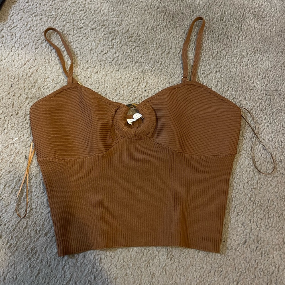 Brown key hole top with adjustable straps. NEVER WORN.
